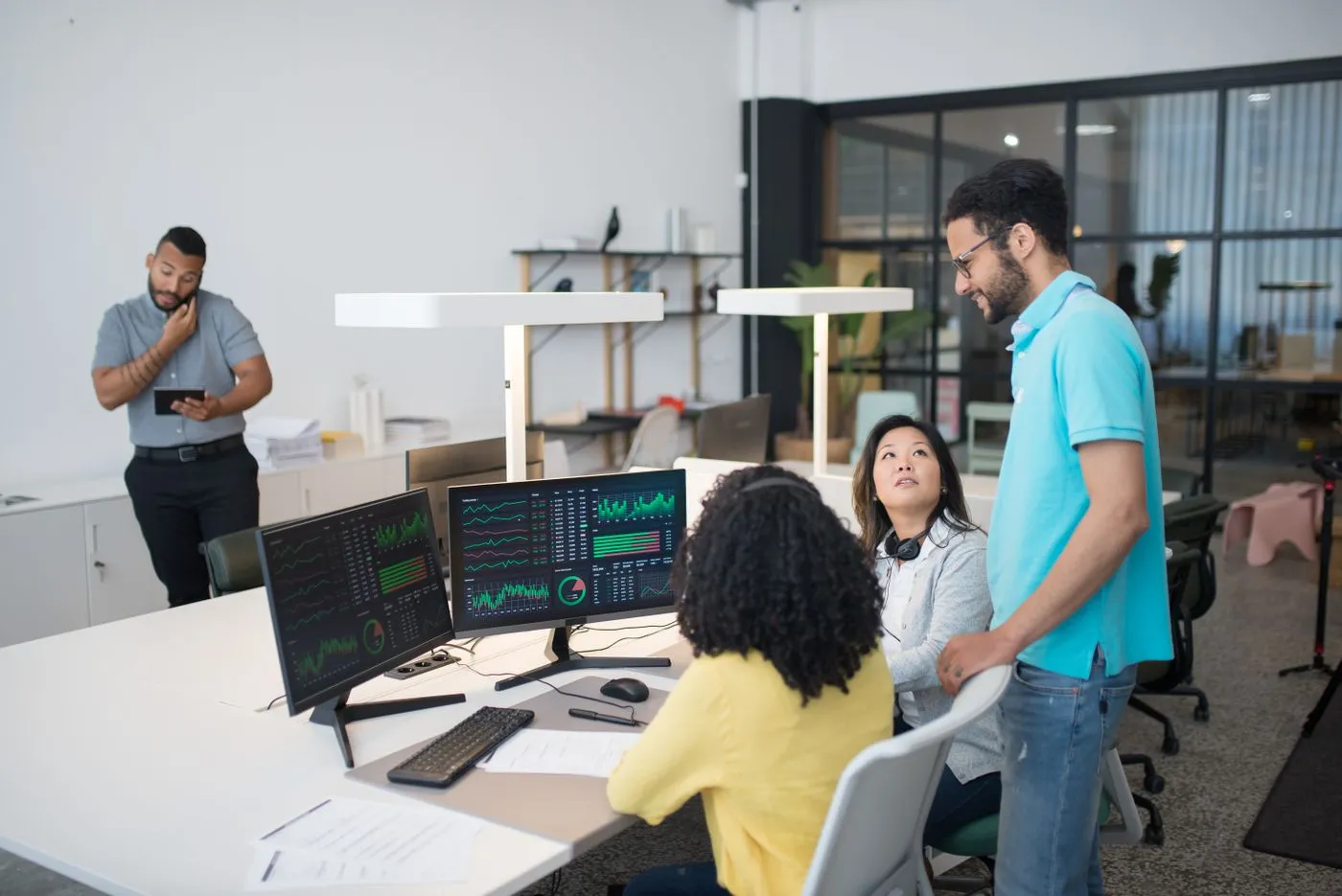 A team reviewing marketing dashboards and data together during in-person training